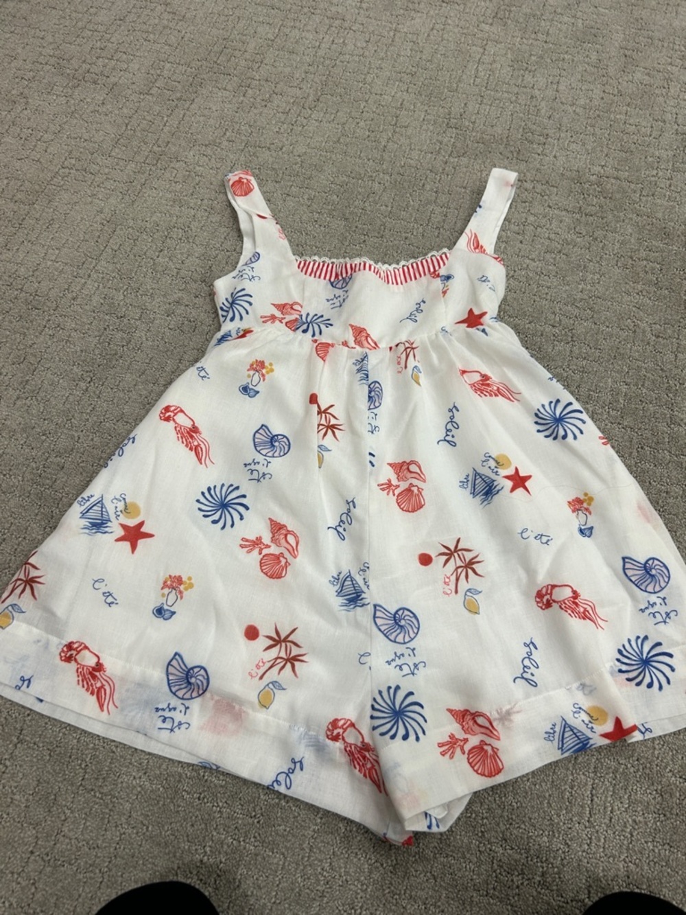 Line & Dot White Sleeveless Nautical Print Romper with Red and Blue Accents